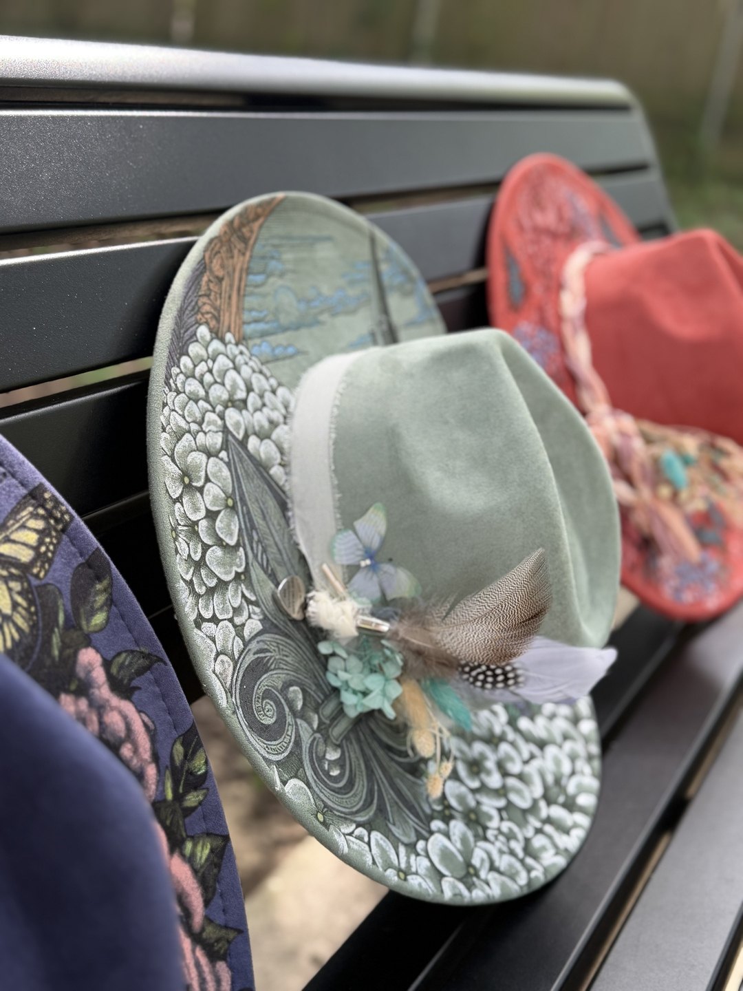 Sage green hand-painted hat with cathedral and hydrangea artwork
