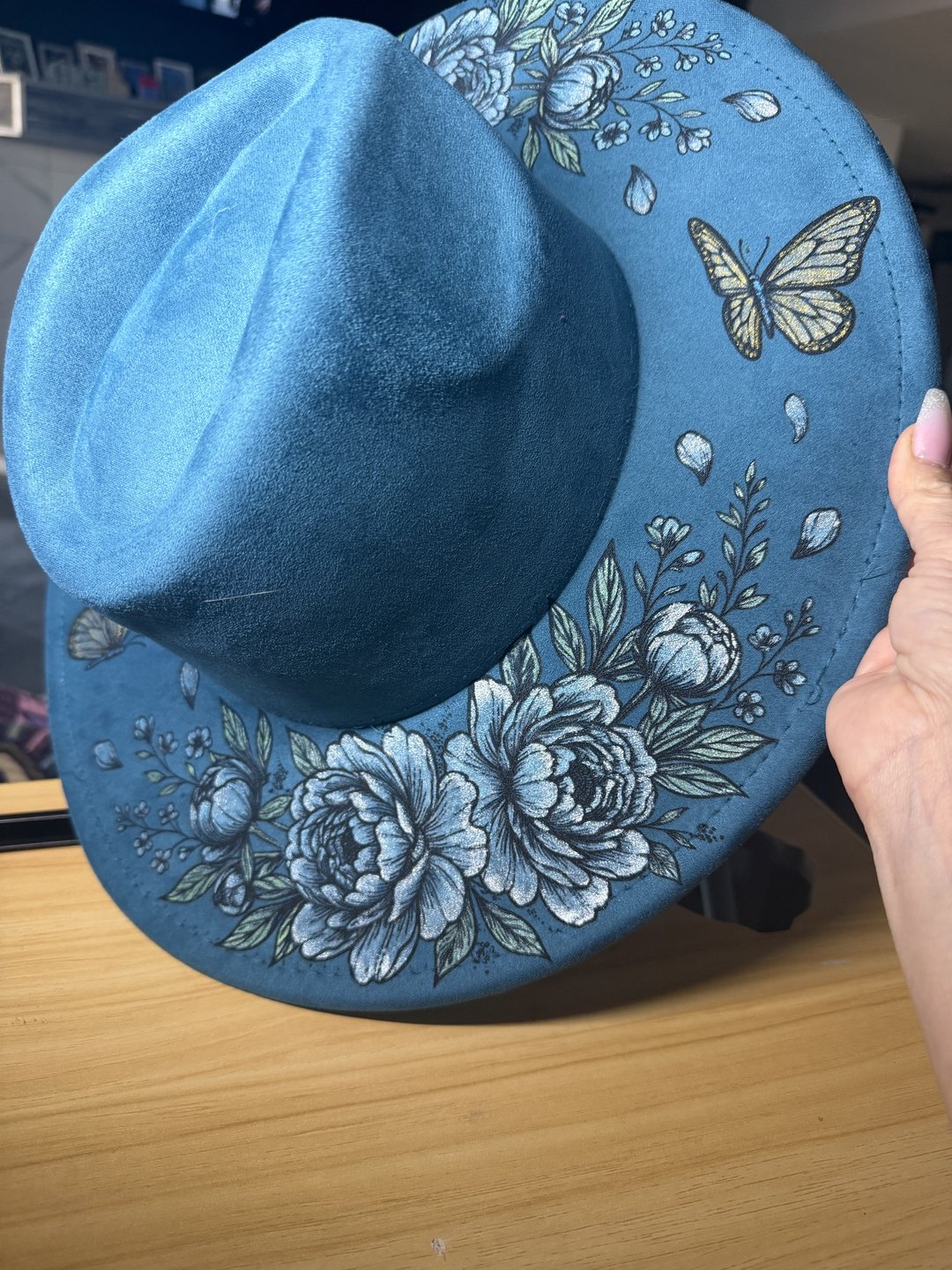Slate blue hand-painted hat brim with silver peonies and a yellow butterfly