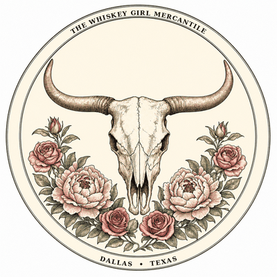 The Whiskey Girl Mercantile color emblem — engraved longhorn skull, butterfly, and florals within a circular seal reading The Whiskey Girl Mercantile, Dallas Texas